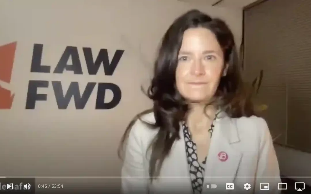Screenshot of video meeting with Gov. Evers, Sen. Booker, and Law Forward staff. Pictured is Law Forward Executive Director NIcole Safar wearing a beige suit in front of a white wall that has Law Forward's logo on it.