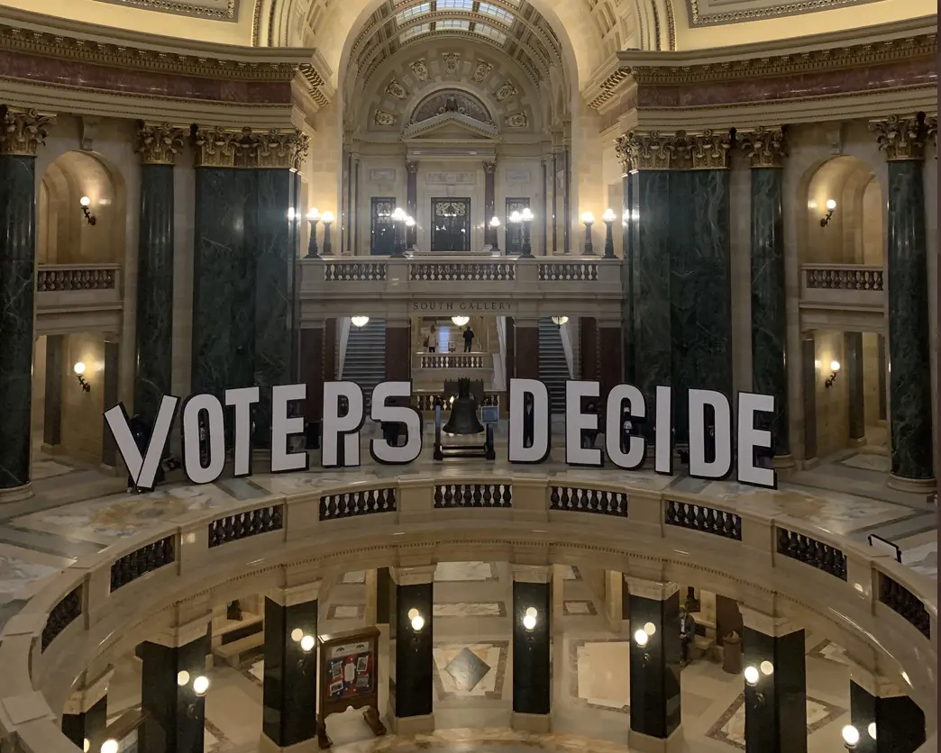  people packed the Capitol with sign that says 'voters decide'